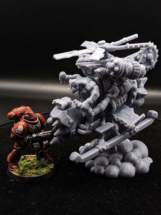 A red resin miniature soldier facing a detailed grey mech model, showcasing vivid creativity in tabletop gaming.