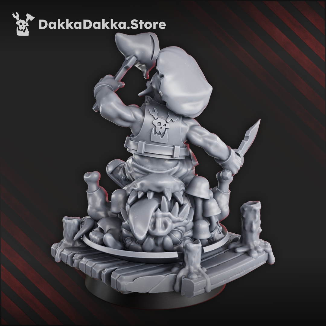 Gobbo Feast Miniature goblin diorama of a gobbo eating a squig creature while standing on a wooden platform, fantasy character model with detailed base