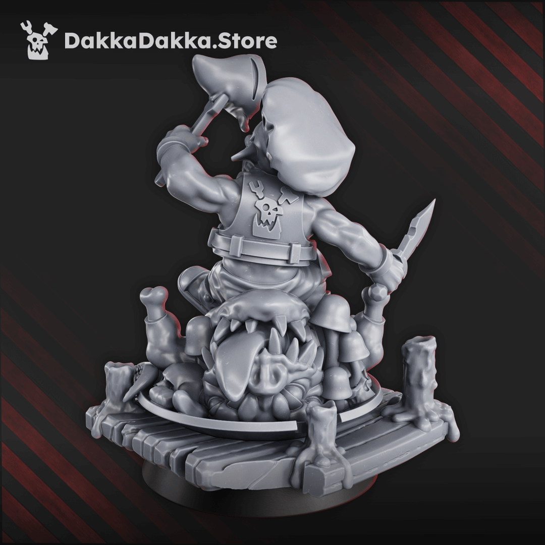 Gobbo Feast Miniature goblin diorama of a gobbo eating a squig creature while standing on a wooden platform, fantasy character model with detailed base