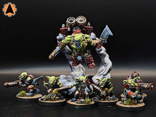 A group of painted Ork miniatures with a large leader figure, showcasing vibrant details and dynamic poses.