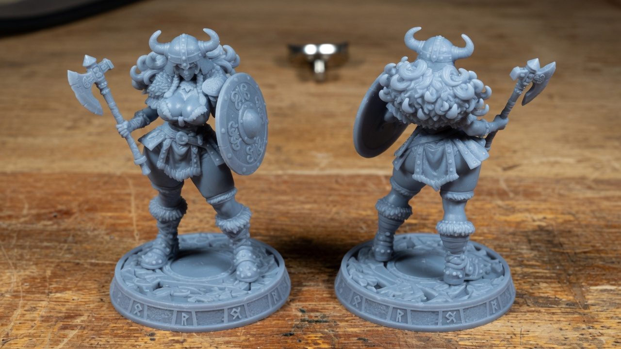 Odin Daughter 7 grey resin miniature front view, Norse shieldmaiden with double axe and knotwork shield