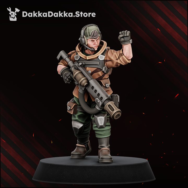Painted resin miniature of a heavy weapons trooper with stubber and raised fist, wearing cap and communications headset, 29mm scale