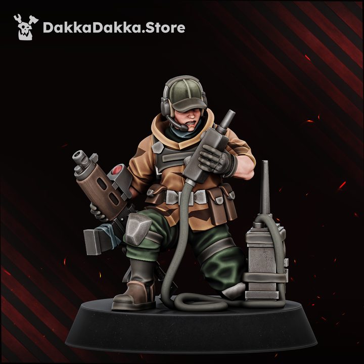 Painted resin vox operator miniature kneeling with communications device and hose-connected weapon, front view