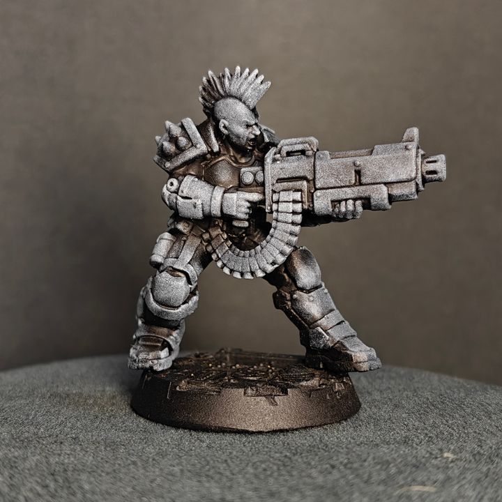 Ballad of the Street Cats Heavy Gunner resin miniature, front view, aiming large weapon with mohawk and layered armour