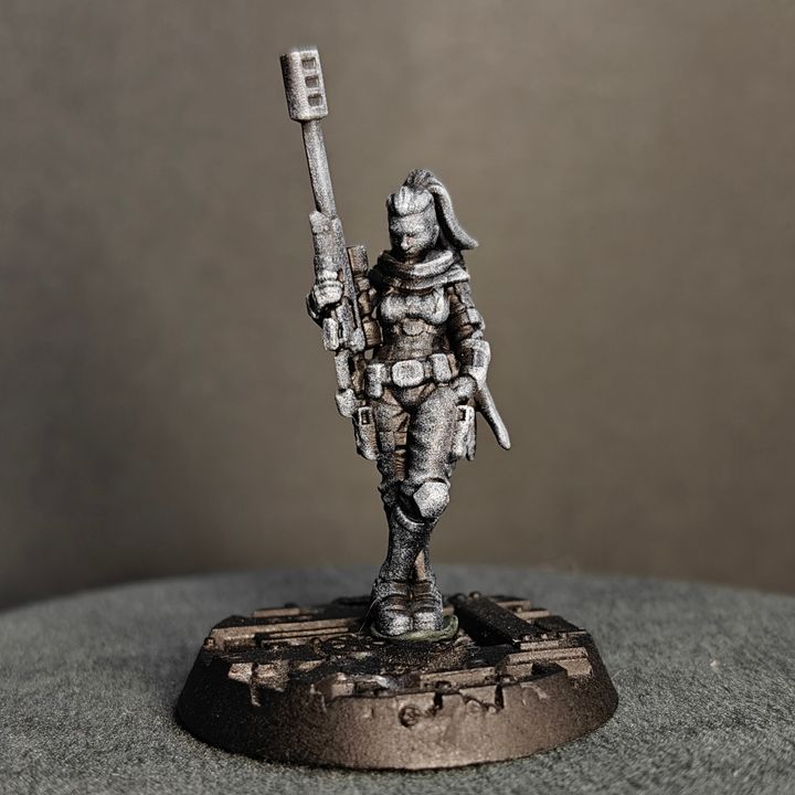 Side view of standing sniper figure holding rifle upright, fitted armour and utility belt visible