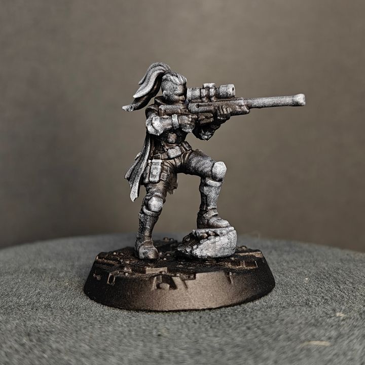 Side profile of kneeling sniper figure aiming scoped rifle, armour detail and ponytail hair visible