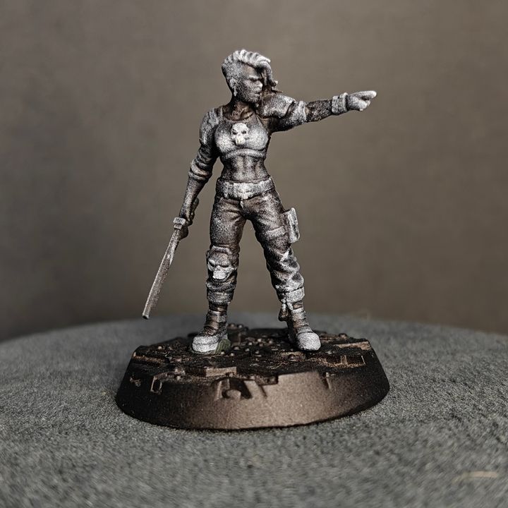 Side view of Street Cats gang leader pointing forward, shortsword at her side, skull chest motif visible