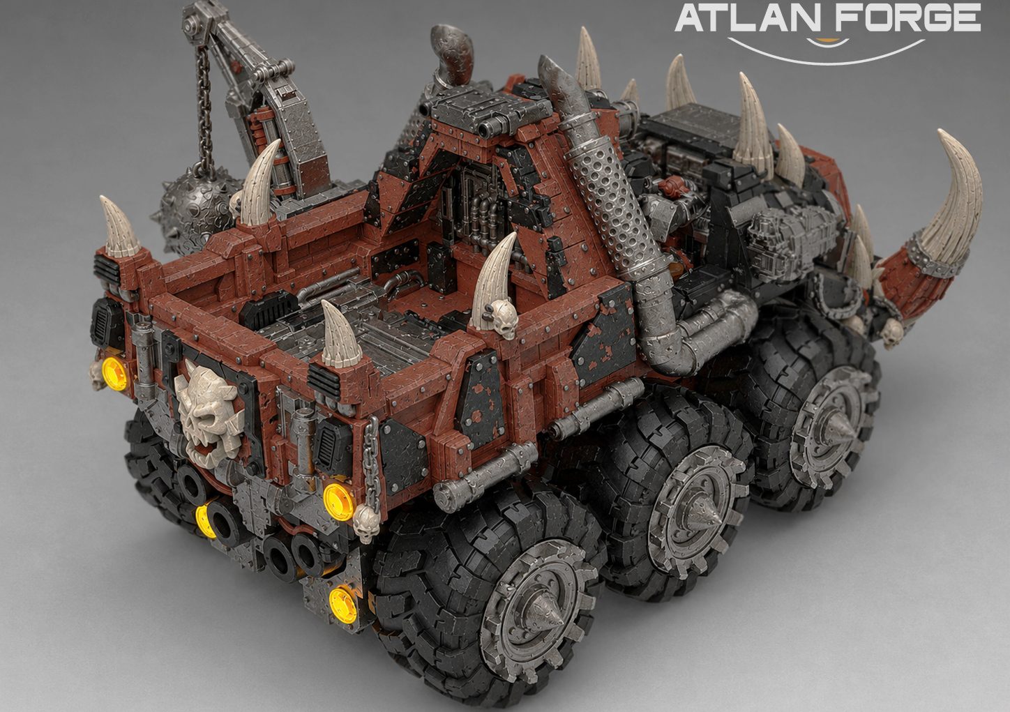 Rear three-quarter view of painted Tuskhauler showing open flatbed bed, skull mounts, and chain details
