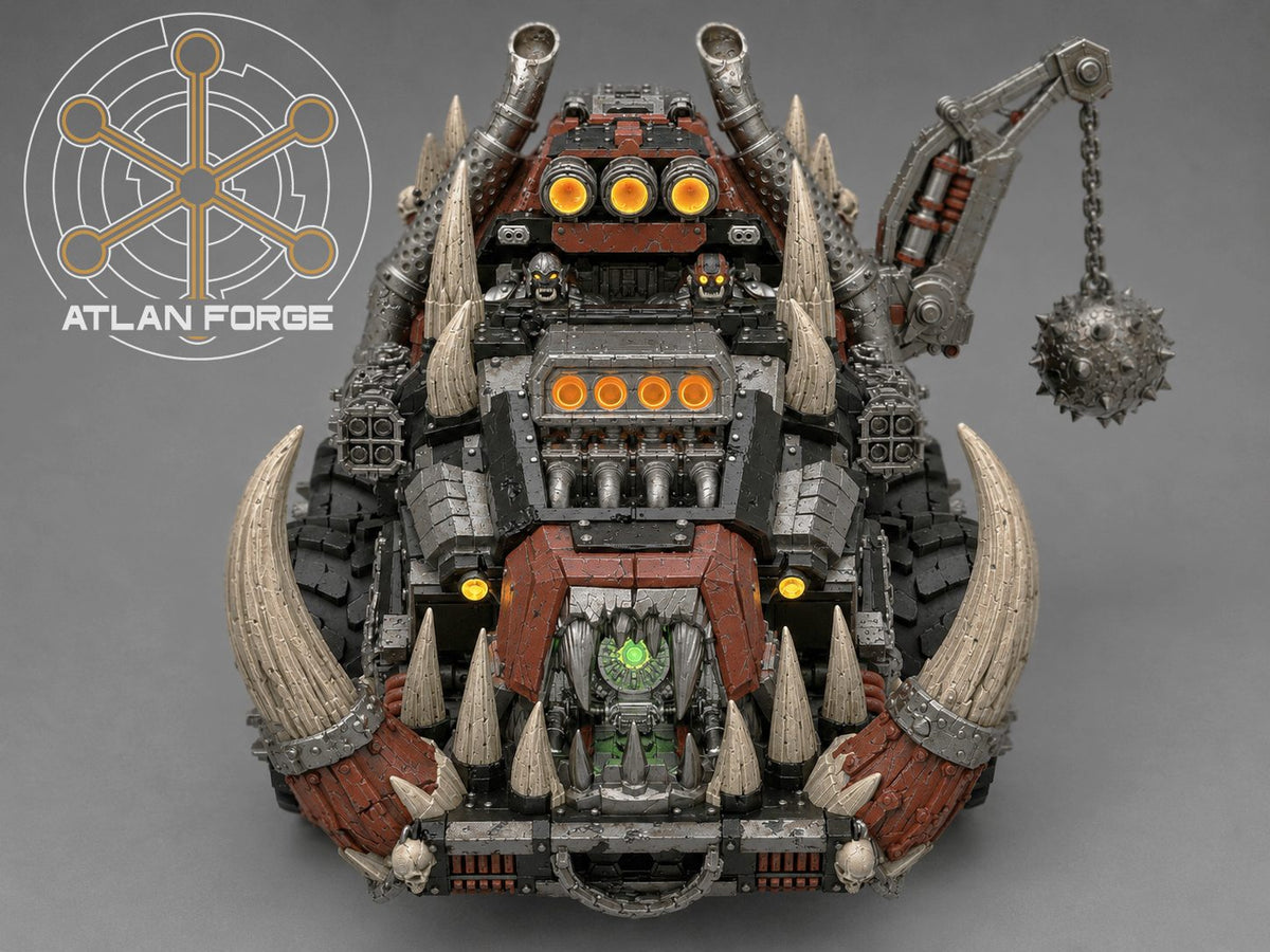 Front-on view of painted Tuskhauler showing full horn assembly, glowing headlamps, and fanged grille