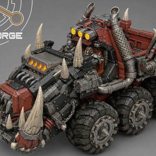 Elevated side view of painted Tuskhauler highlighting oversized tires, tusked jaw, and driver cabin.